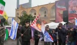 Iranians burn US and Israeli flags on streets of Tehran as Trump sends chilling threat